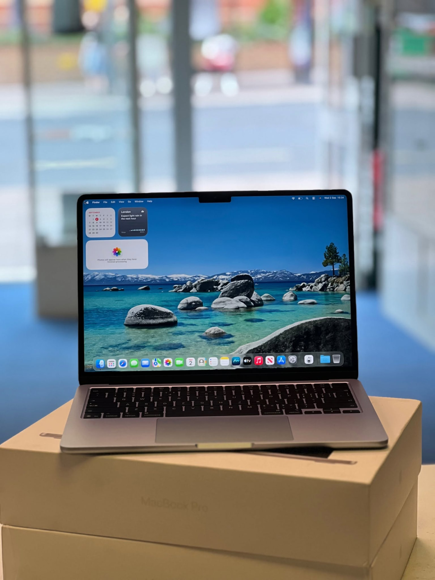 A MacBook Air on its box inside the Titan Computers shop