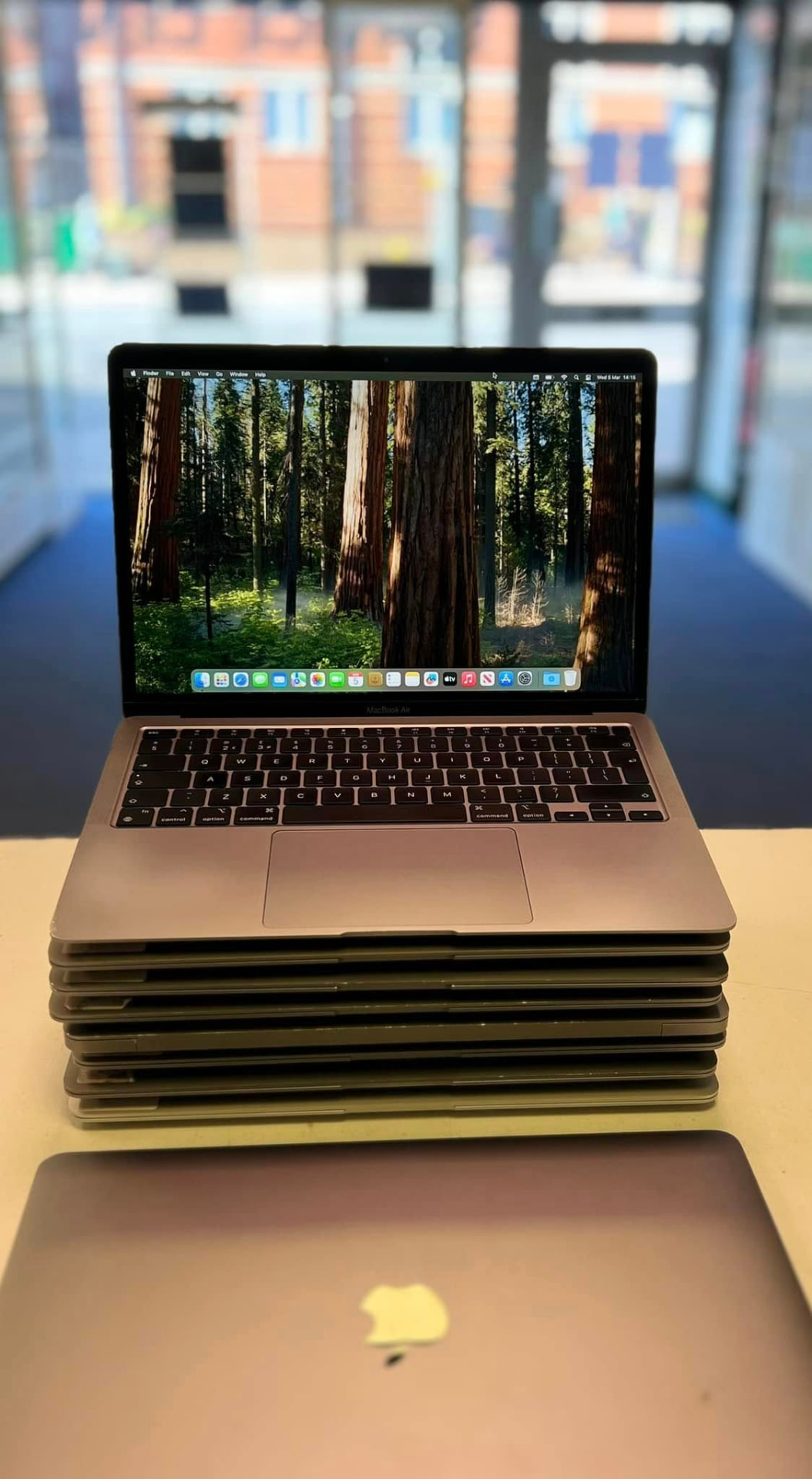 A stack of MacBook Air laptops in the Titan Computers shop